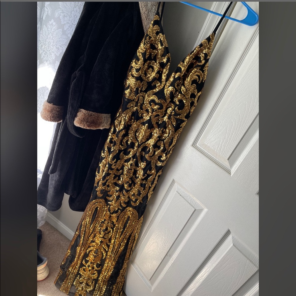 Black and gold sequin dress